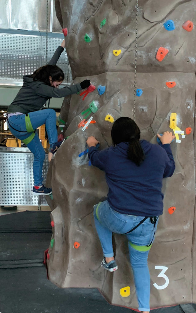 Having fun on campus, trying out UW-Green Bay's climbing wall