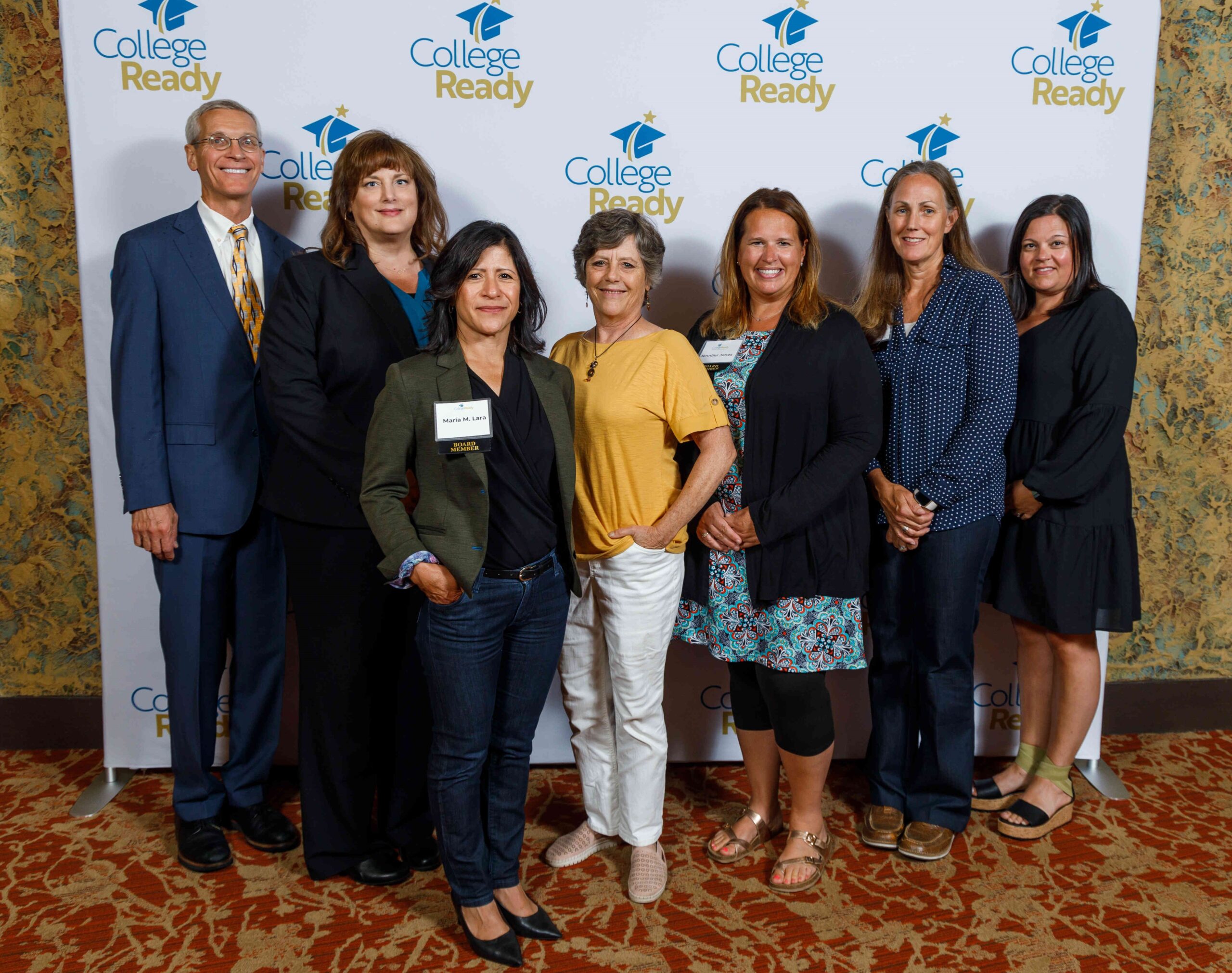 Several of CollegeReady's board members stand together at the 2023 Lamp of Knowledge Celebration